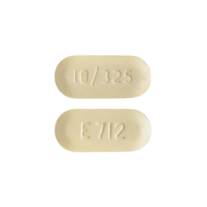 two Percoocet 10/325mg pills with numbers and letters