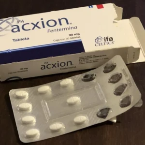 a package of pills next to a Acxion 30mg box