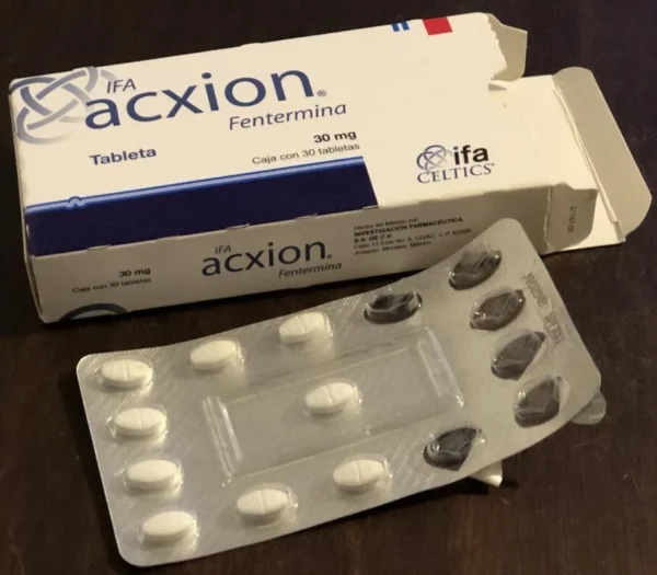 a package of pills next to a Acxion 30mg box